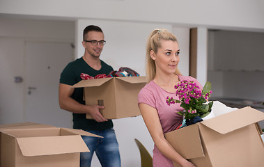 Image showing young couple moving into a new home