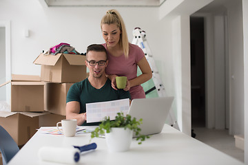 Image showing Young couple moving in a new home