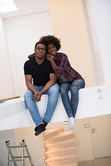 Image showing couple having break during moving to new house