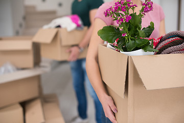 Image showing young couple moving into a new home