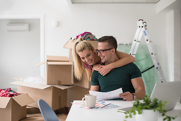 Image showing Young couple moving in a new home