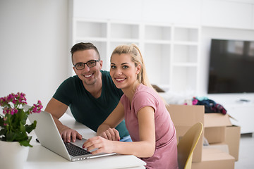 Image showing Young couple moving in a new home