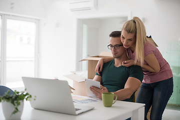 Image showing Young couple moving in a new home