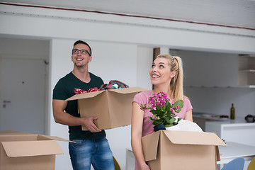 Image showing young couple moving into a new home