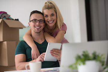 Image showing Young couple moving in a new home