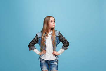 Image showing Young serious thoughtful teen girl. Doubt concept.