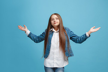 Image showing Beautiful teen girl looking suprised and bewildered isolated on pink