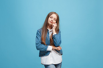 Image showing Young serious thoughtful teen girl. Doubt concept.