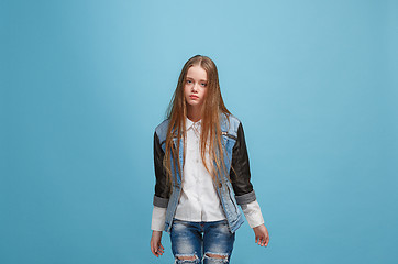 Image showing Young serious thoughtful teen girl. Doubt concept.