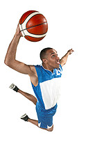 Image showing Full length portrait of a basketball player with ball