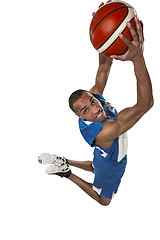 Image showing Full length portrait of a basketball player with ball