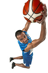 Image showing Full length portrait of a basketball player with ball