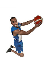 Image showing Full length portrait of a basketball player with ball