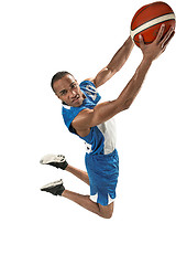 Image showing Full length portrait of a basketball player with ball