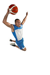 Image showing Full length portrait of a basketball player with ball