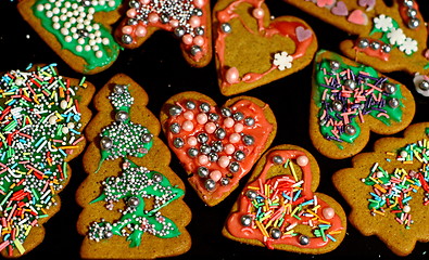 Image showing Homemade christmas cookies on a dark table