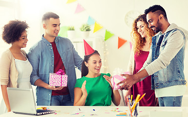 Image showing team greeting colleague at office birthday party