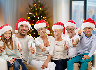 Image showing happy family sitting on couch at home