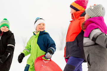 Image showing happy little kids with sleds in winter