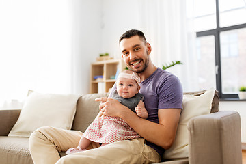 Image showing father with little baby girl at home