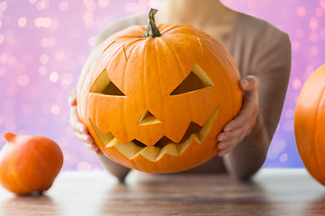 Image showing close up of woman with halloween pumpkin