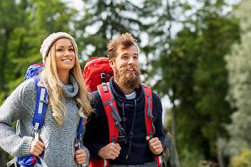 Image showing couple of travelers with backpacks hiking