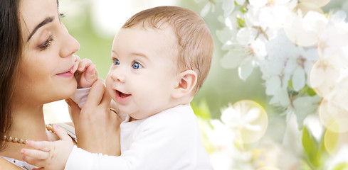 Image showing mother with baby over cherry blossom background