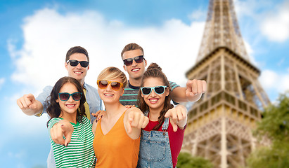 Image showing friends pointing at you over eiffel tower