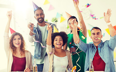 Image showing happy team with confetti at office birthday party