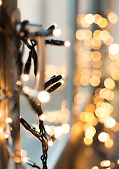 Image showing close up of christmas garland on window