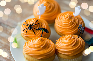 Image showing halloween party decorated cupcakes on plate