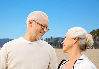 Image showing happy senior couple over venice beach background