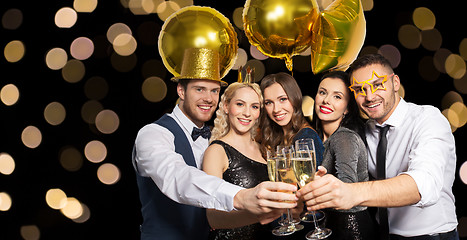 Image showing happy friends clinking champagne glasses at party