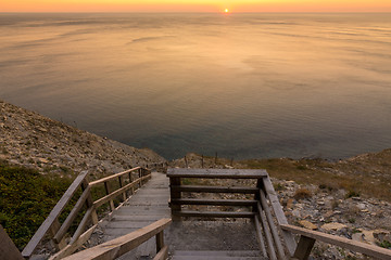 Image showing Ladder going down to the sea at sunset, Anapa, Russia