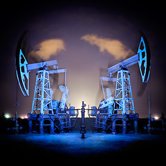 Image showing Oil Rigs at night.