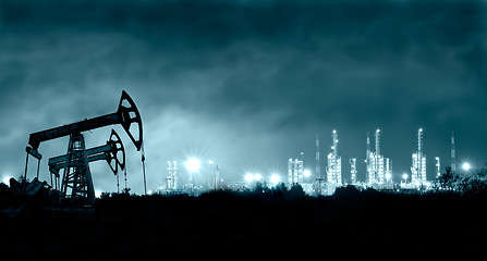 Image showing Pump jack and grangemouth refinery at night.