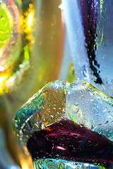 Image showing Bright colorful abstract background. Glass and drops of water.