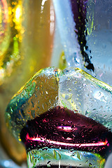 Image showing Bright colorful abstract background. Glass and drops of water.