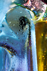 Image showing Bright colorful abstract background. Glass and drops of water.