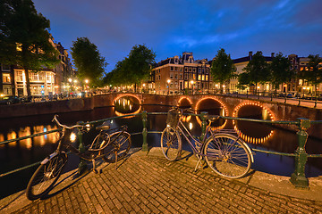 Image showing Amterdam canal, bridge and medieval houses in the evening