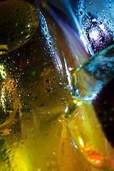 Image showing Bright colorful abstract background. Glass and drops of water.