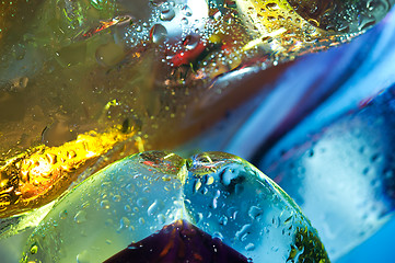 Image showing Bright colorful abstract background. Glass and drops of water.