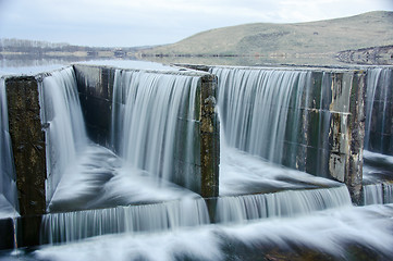 Image showing water flowing over a dam