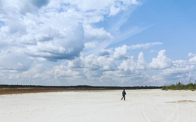 Image showing Person Walking Through Sandy Desert Under a Beautiful Sky