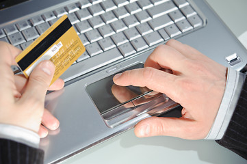 Image showing notebook, credit card and man's hands