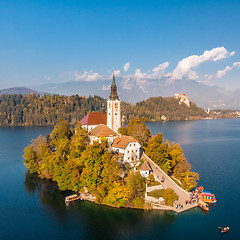 Image showing Bled island on lake Bled, and Bled castle and mountains in background, Slovenia.