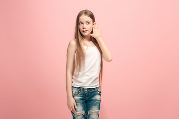 Image showing The happy teel girl standing and listening