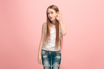 Image showing The happy teel girl standing and listening