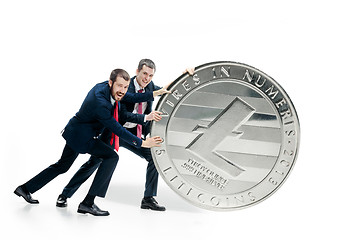 Image showing Two business men holding business icon