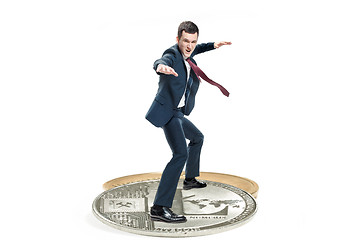 Image showing The business man standing on business icon